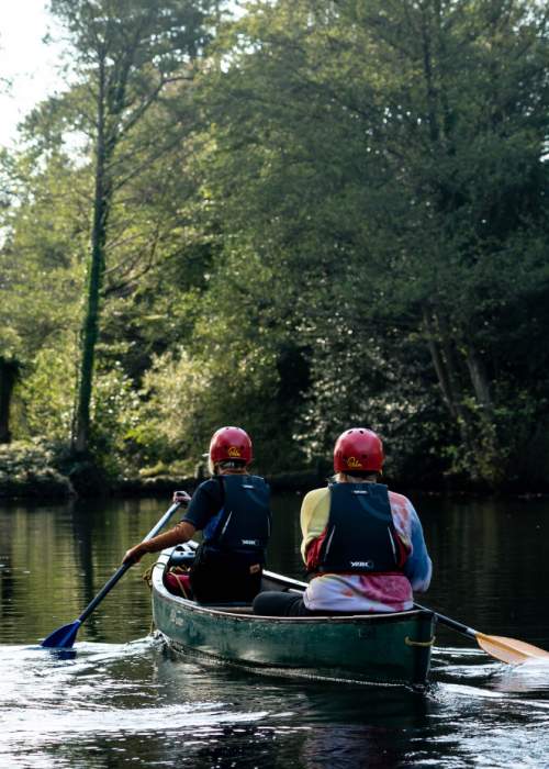Canoeing in lake at Foxlease in the New Forest