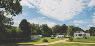 Caravans and tents at campsite in the New Forest